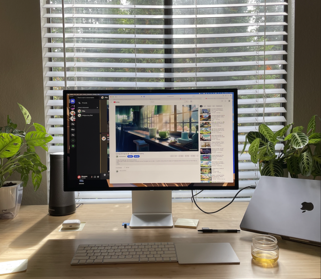 A working desktop with cup of tea on the side